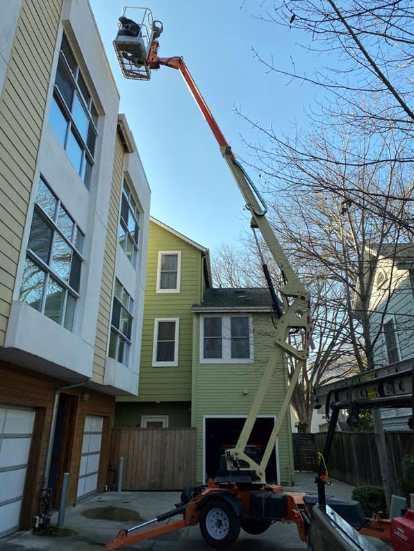 Boom lift for tall building roof access